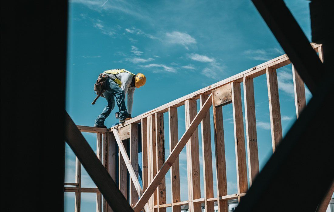 A Construction Worker on Top of a Wooden Structure — MoneySmith Group In Kingscliff, NSW
