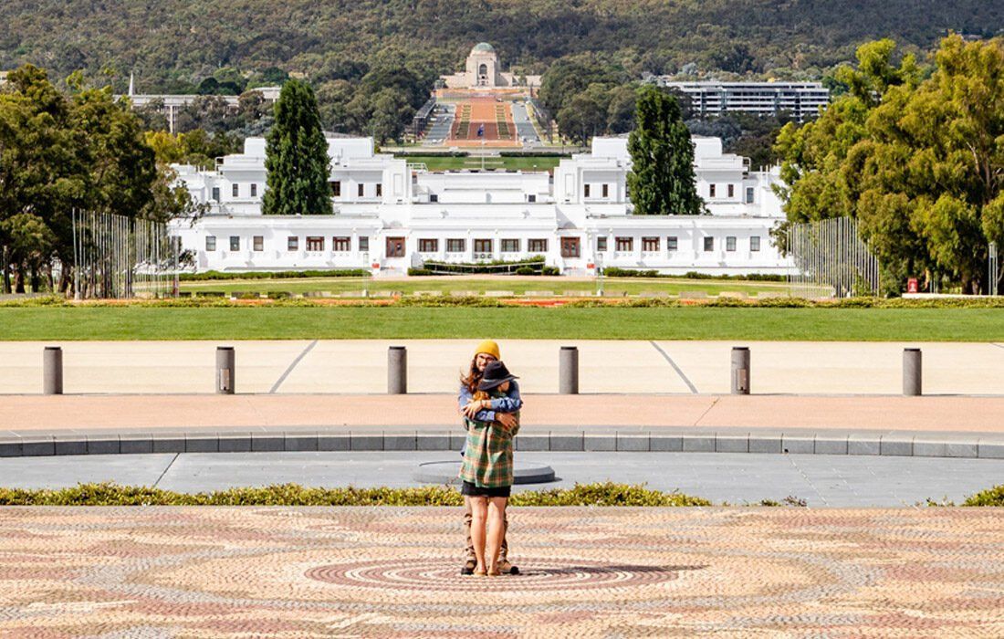 Person is Standing in Front of a Large White Building — MoneySmith Group In Kingscliff, NSW