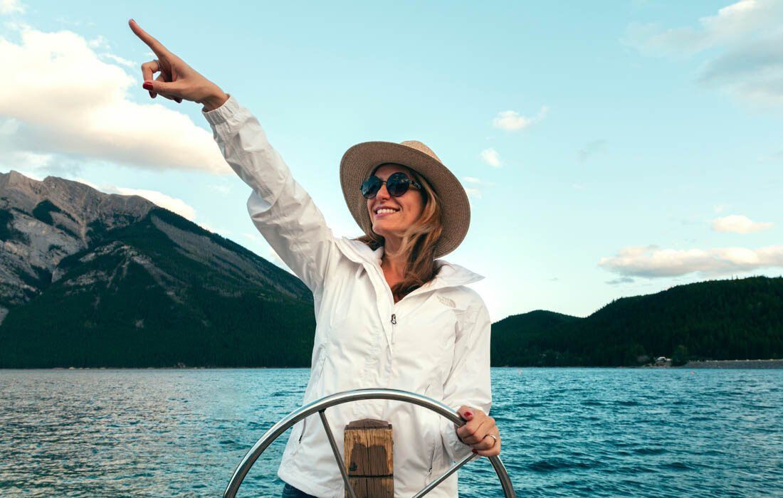 Happy Woman on a Boat — MoneySmith Group In Kingscliff, NSW