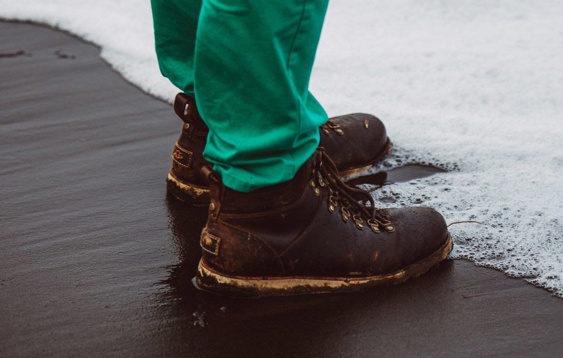 A Person Wearing Green Pants and Brown Boot — MoneySmith Group In Kingscliff, NSW