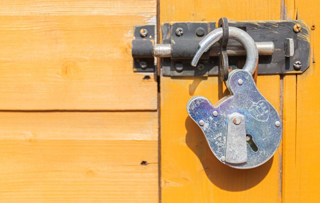 A Close Up of a Padlock on a Wooden Door — MoneySmith Group In Kingscliff, NSW