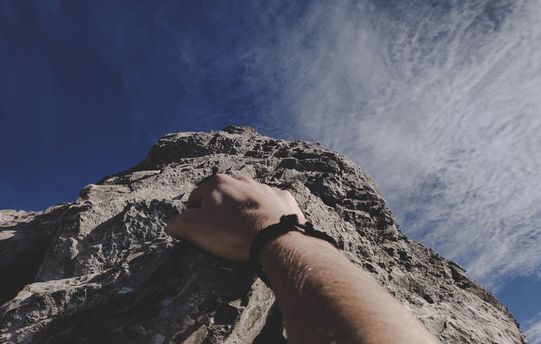 A Person's Hand is Pointing Up at a Mountain — MoneySmith Group In Kingscliff, NSW