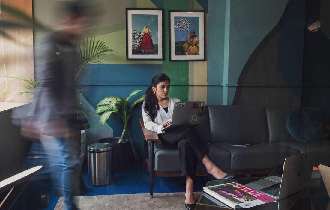 A Woman is Sitting on a Couch — MoneySmith Group In Kingscliff, NSW