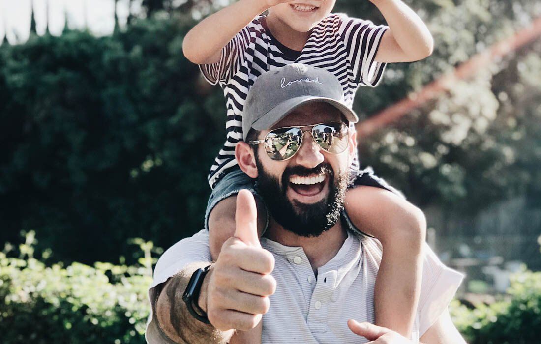 A Man is Carrying a Child — MoneySmith Group In Kingscliff, NSW