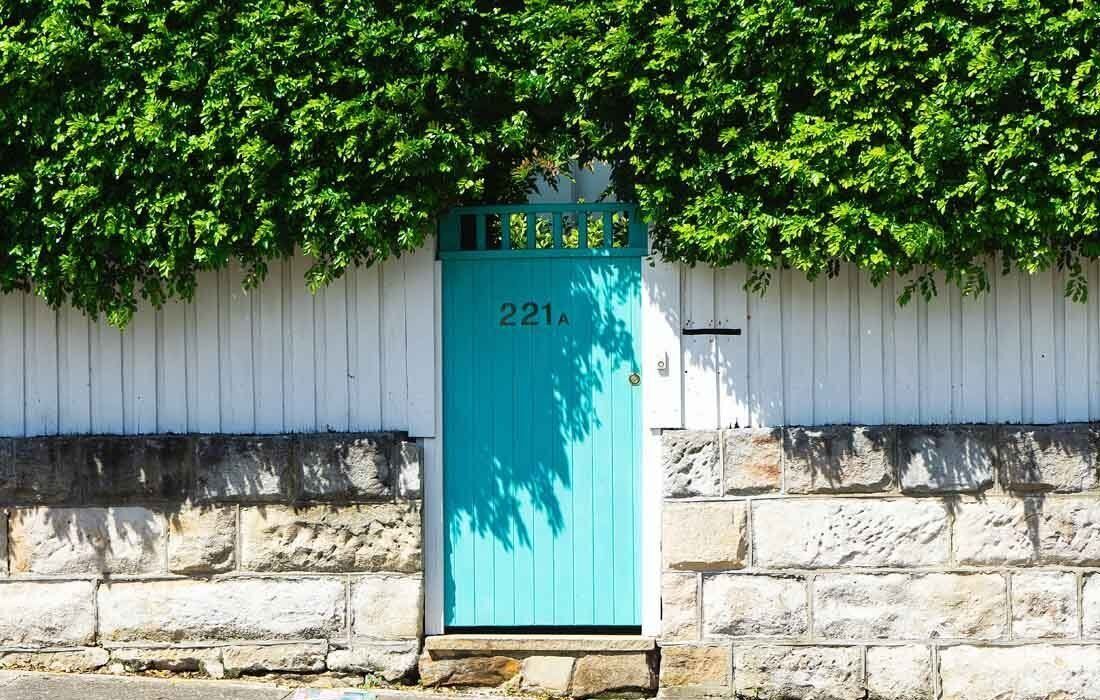 A Blue Door With the Number 221 on It — MoneySmith Group In Kingscliff, NSW