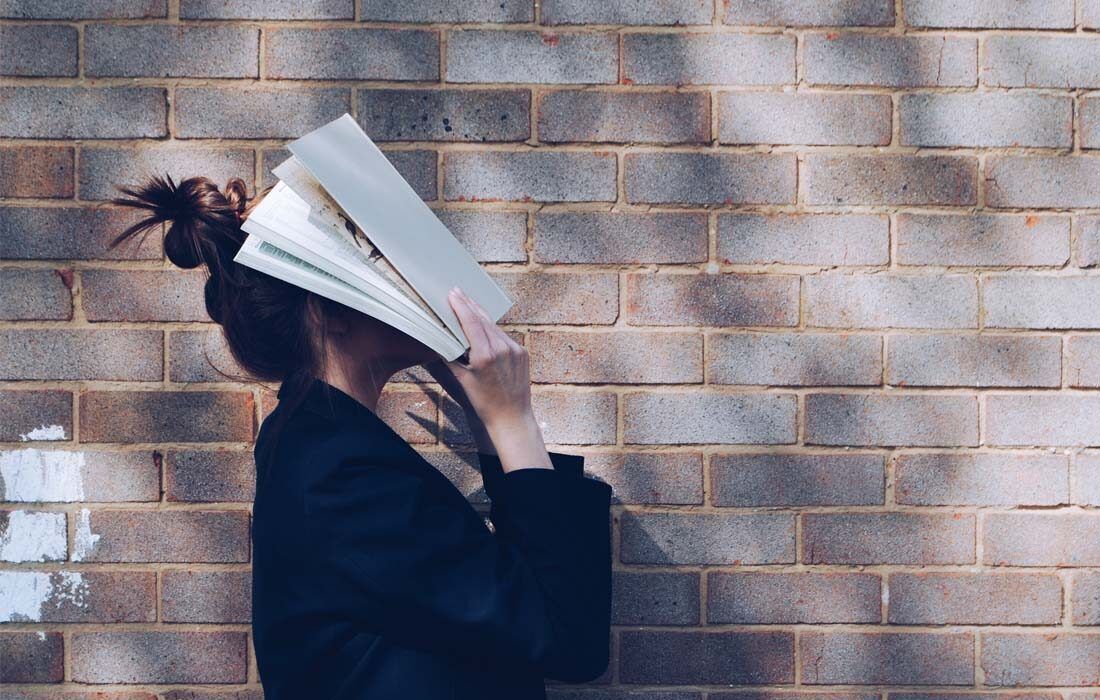 A Woman is Reading a Book — MoneySmith Group In Kingscliff, NSW