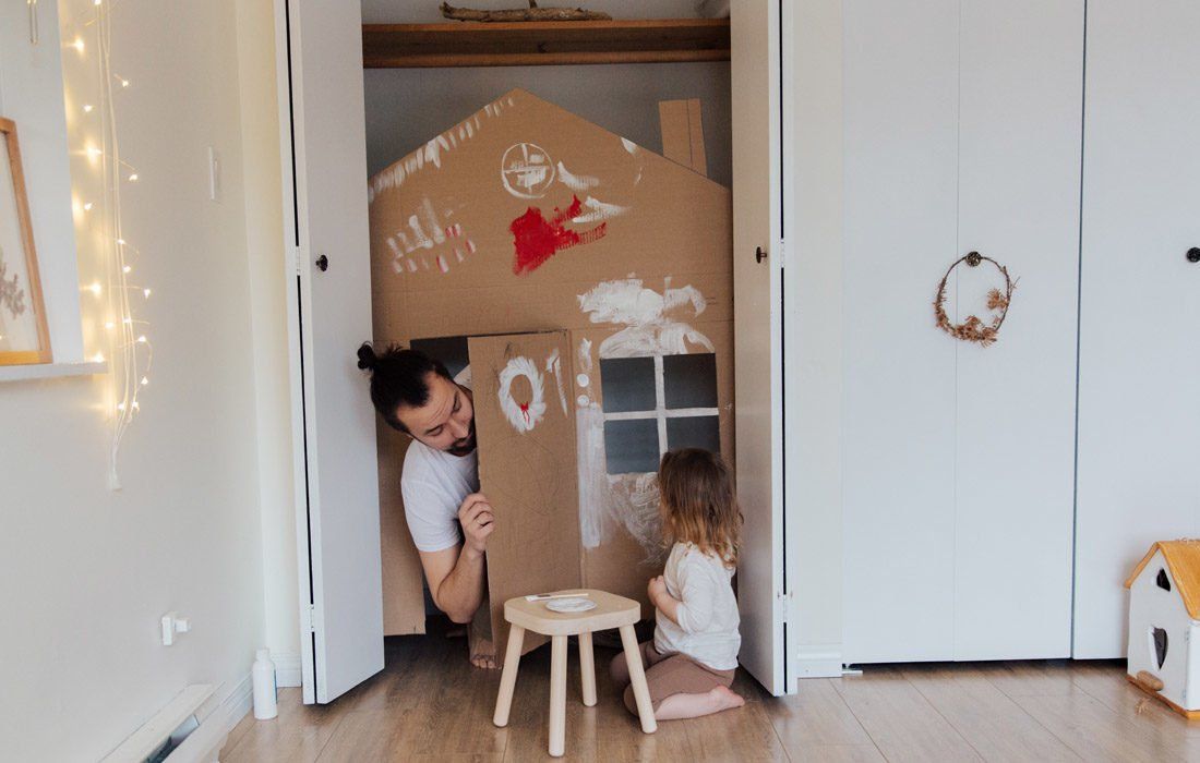 A Man and a Little Girl Are Playing in a Cardboard House — MoneySmith Group In Kingscliff, NSW