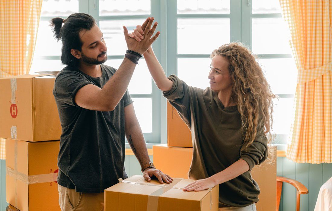 Man and a Woman Are Giving Each Other a High Five — MoneySmith Group In Kingscliff, NSW
