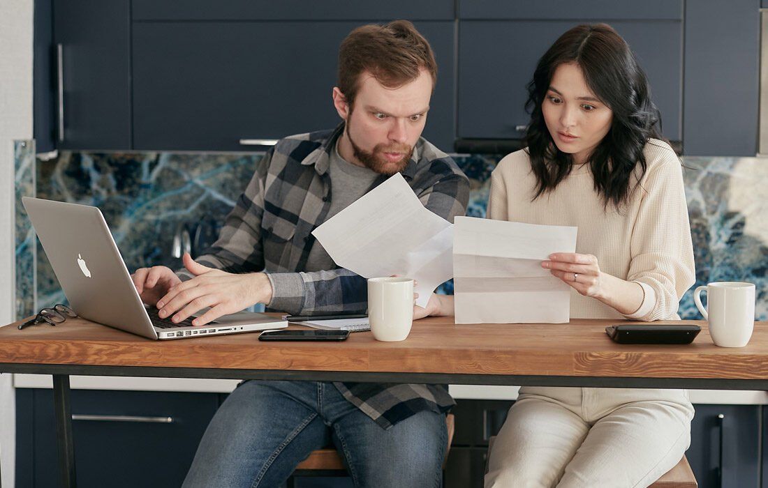 A Person is Using a Calculator on Top of a Notebook — MoneySmith Group In Kingscliff, NSW