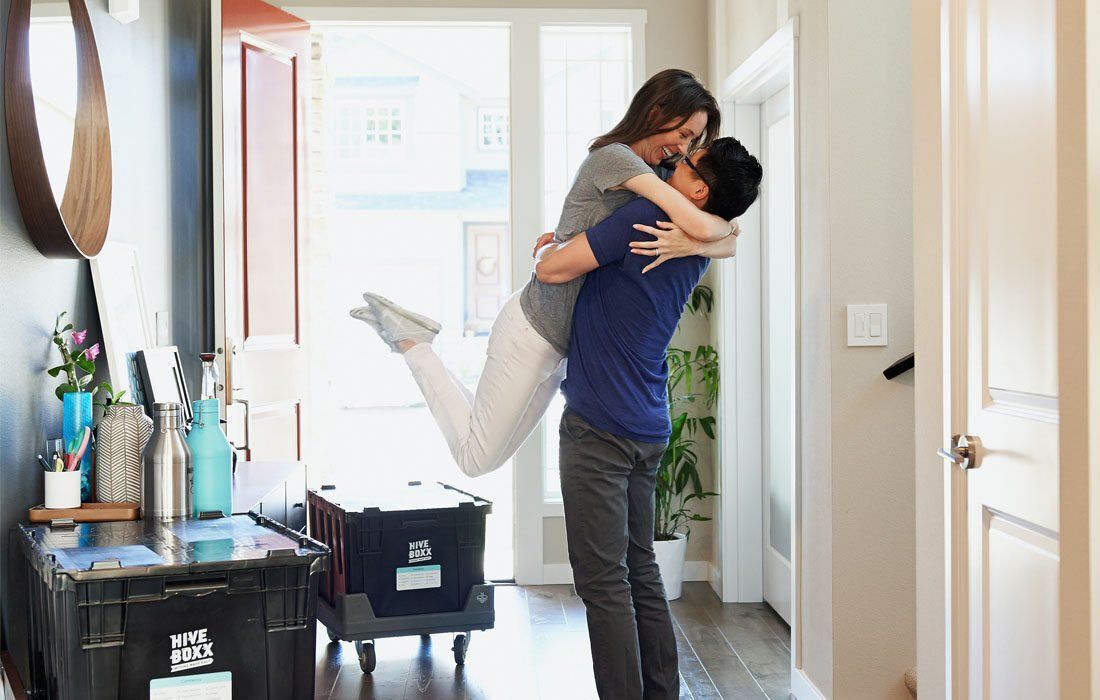 A Man is Holding a Woman in His Arms — MoneySmith Group In Kingscliff, NSW
