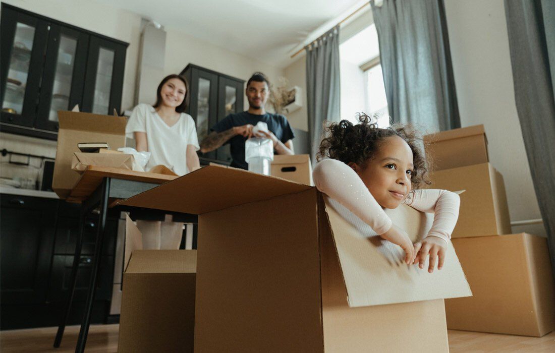 Little Girl is Sitting in a Cardboard Box — MoneySmith Group In Kingscliff, NSW