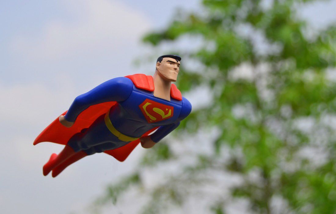 A Superman Toy is Flying Through the Air — MoneySmith Group In Kingscliff, NSW
