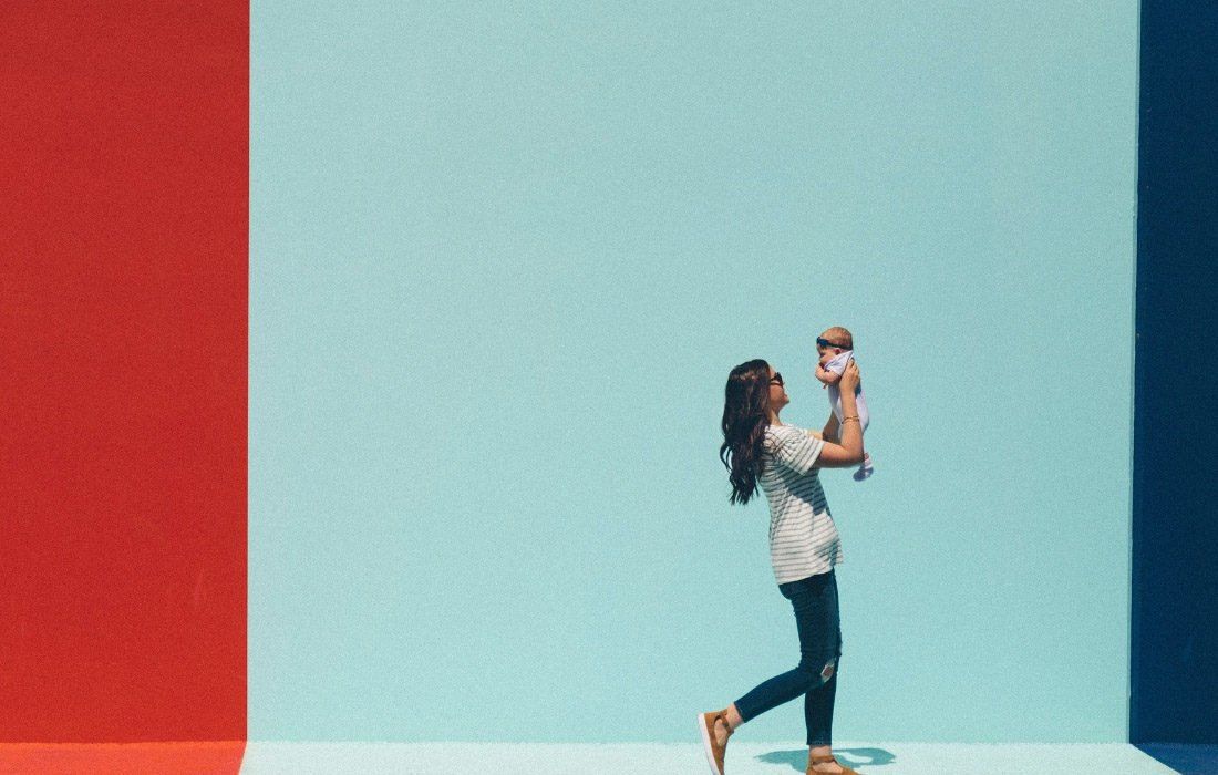 A Woman is Holding a Baby — MoneySmith Group In Kingscliff, NSW