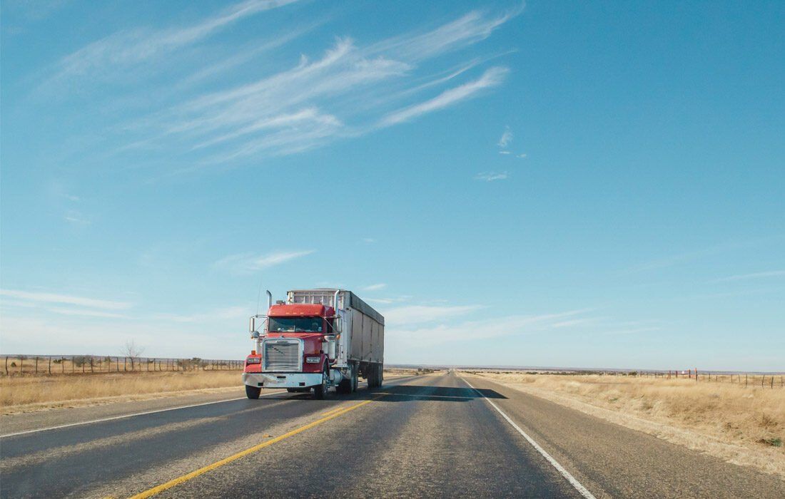 Red Semi Truck is Driving — MoneySmith Group In Kingscliff, NSW