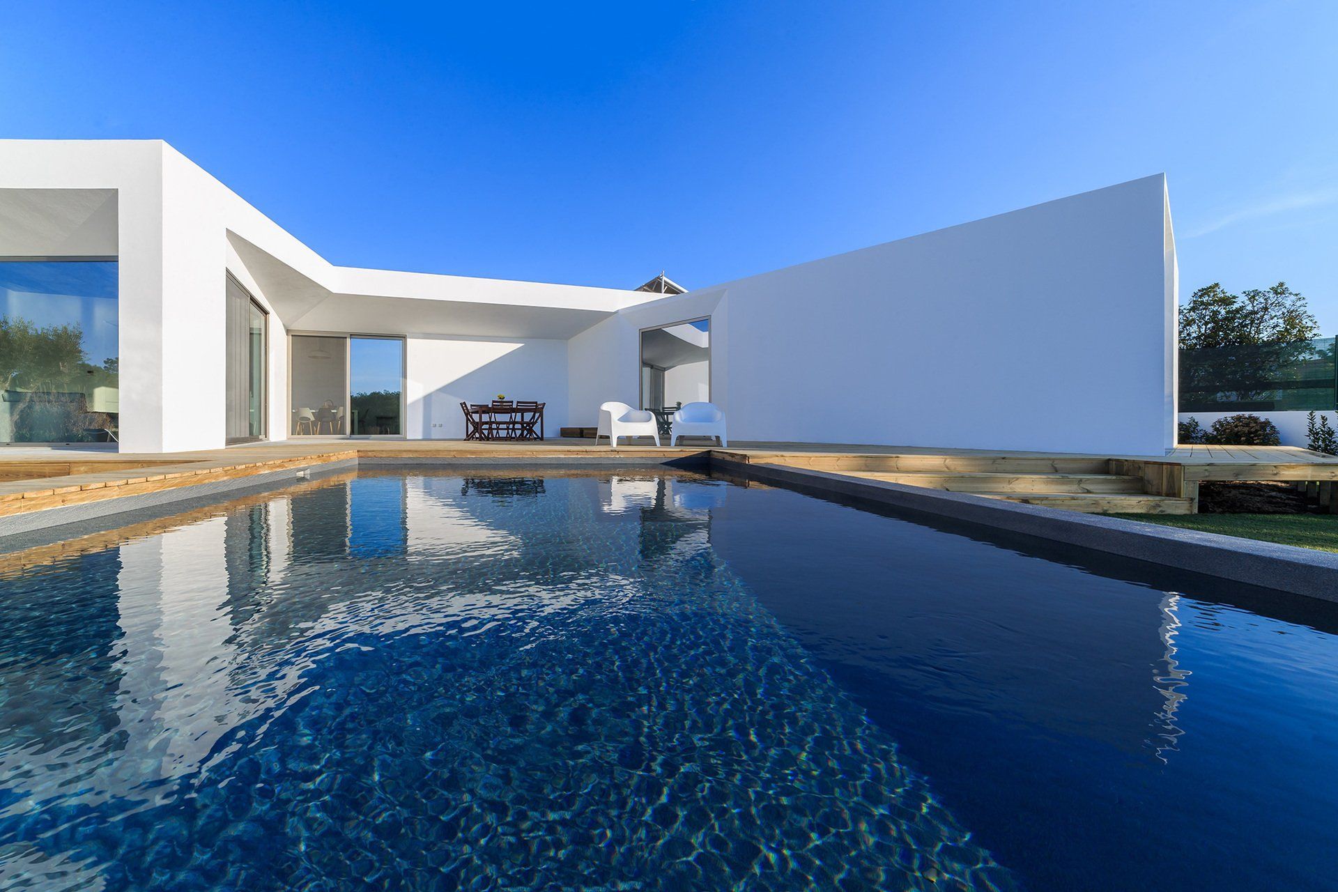 A Modern White House With a Large Swimming Pool — MoneySmith Group In Kingscliff, NSW