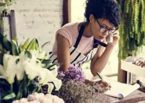 A Woman is Talking on a Cell Phone — MoneySmith Group In Kingscliff, NSW