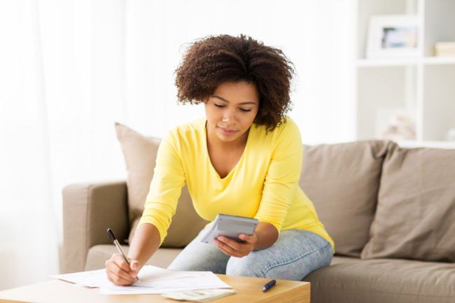 A Woman is Sitting on a Couch — MoneySmith Group In Kingscliff, NSW