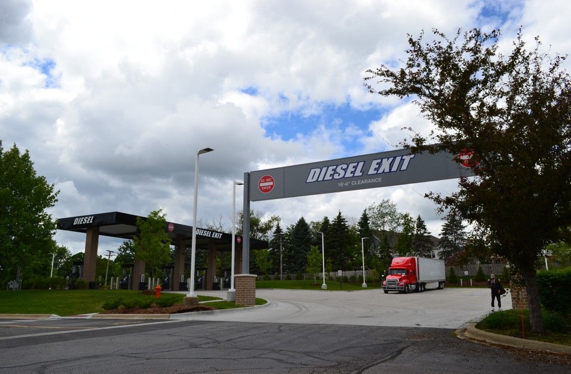 A truck is parked in front of a diesel exit sign