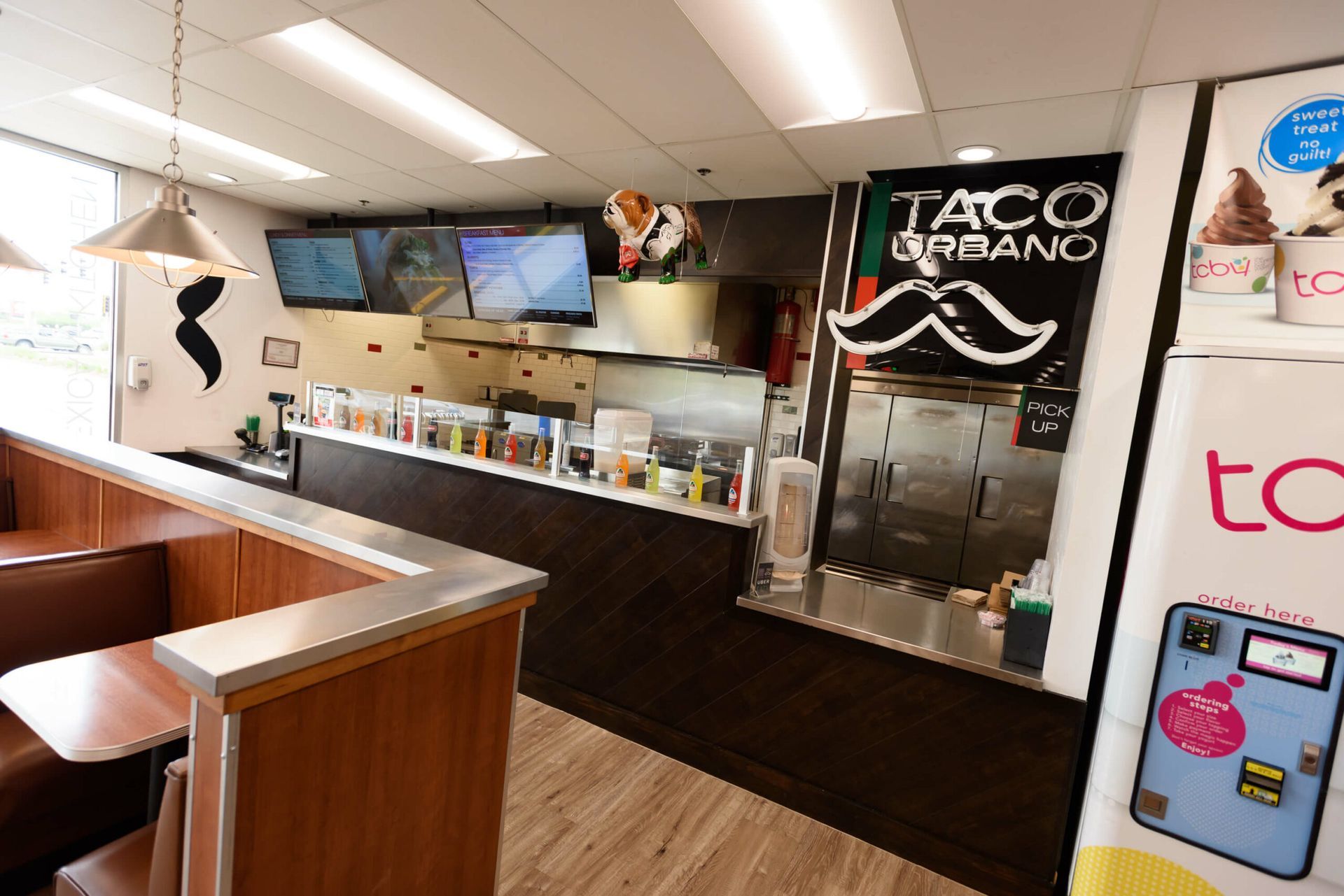 A restaurant with a sign that says taco urbano on it.