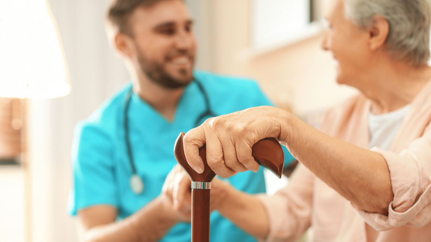 A nurse is helping an elderly woman with a cane.