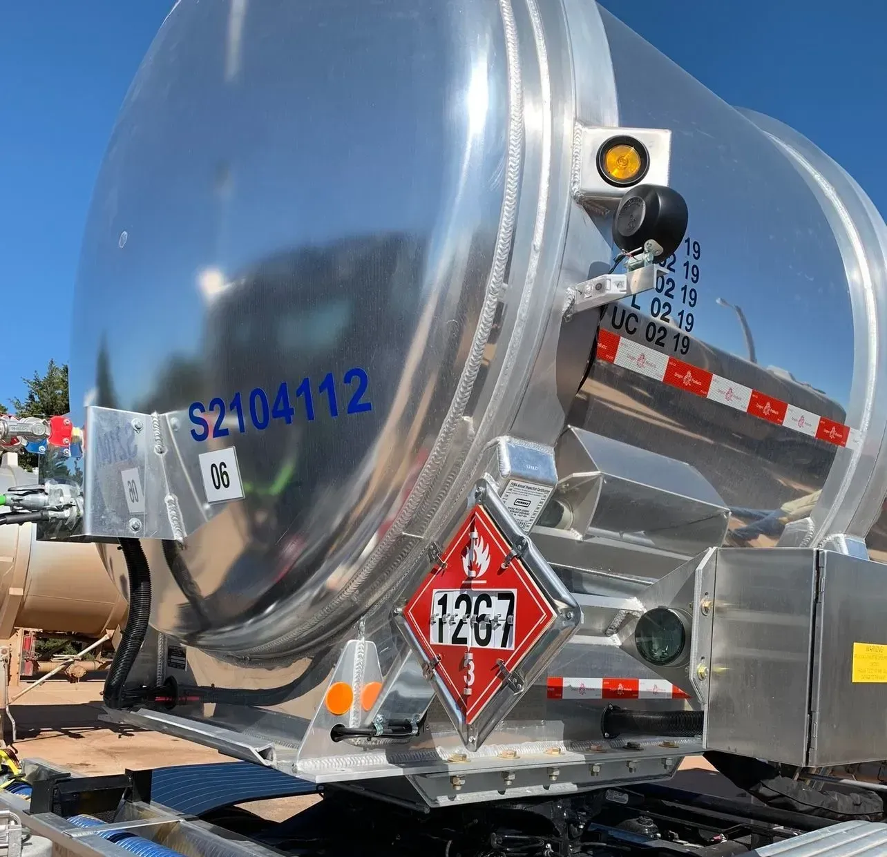 A silver tank with the numbers s2104112 on it