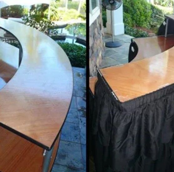 Two pictures of a wooden table with a black skirt