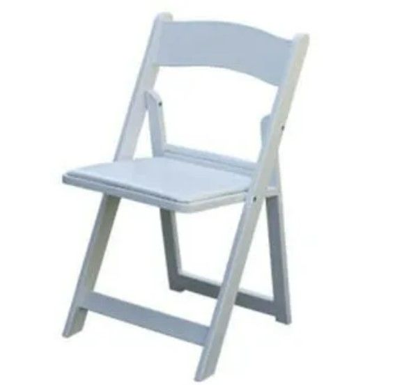 A white folding chair with a white cushion on a white background.