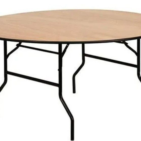 A round wooden table with black legs on a white background.