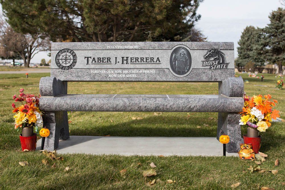 Front view of Herrera bench-style headstone with forest landscape and deer engraving