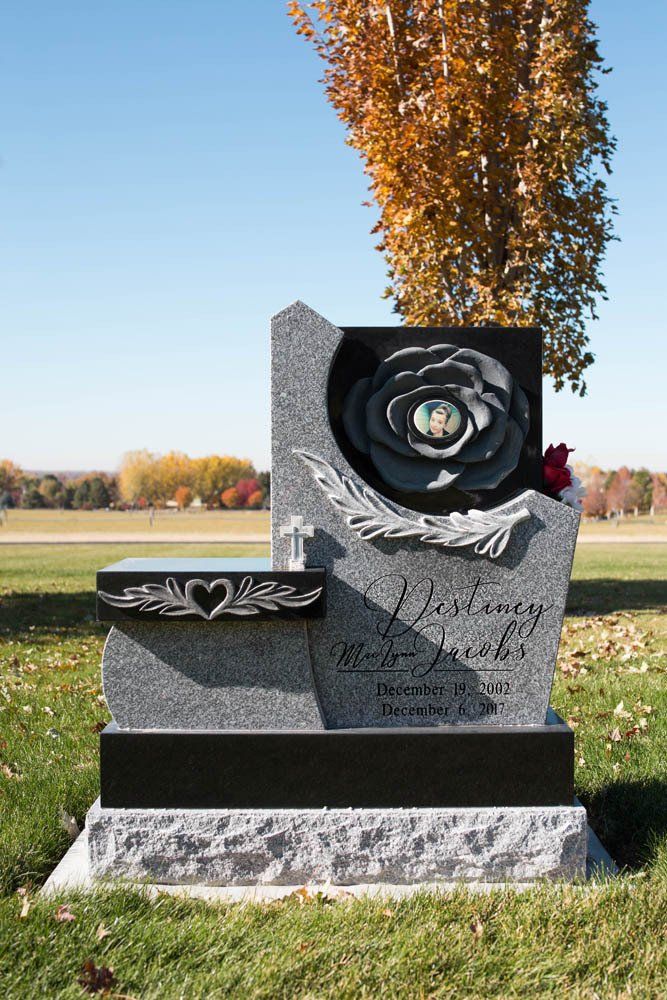 Jacobs family memorial with sculpted rose design, heart photo medallion, and floral engraving
