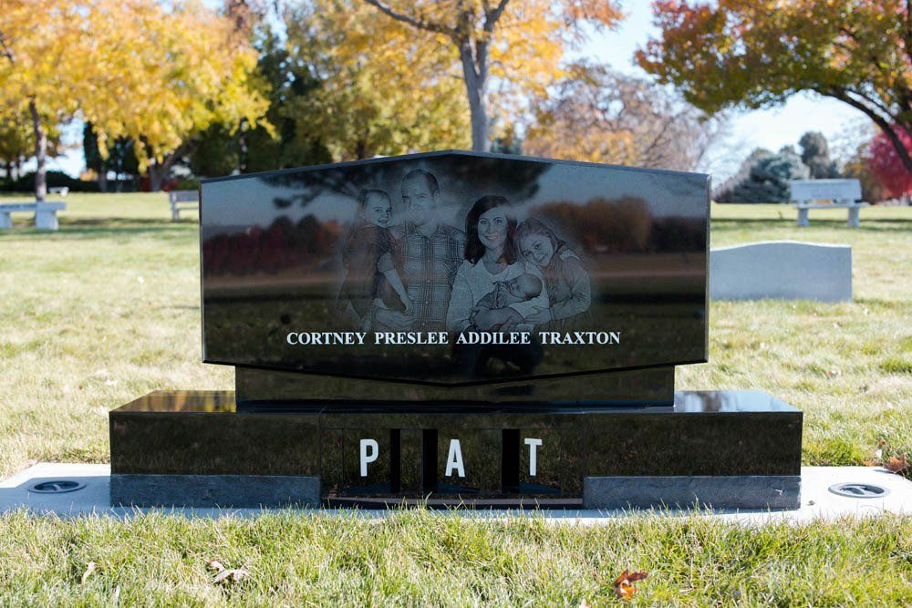 Polished black granite memorial for Cortney Presley Addilee Traxton with “PAT” engraved at base