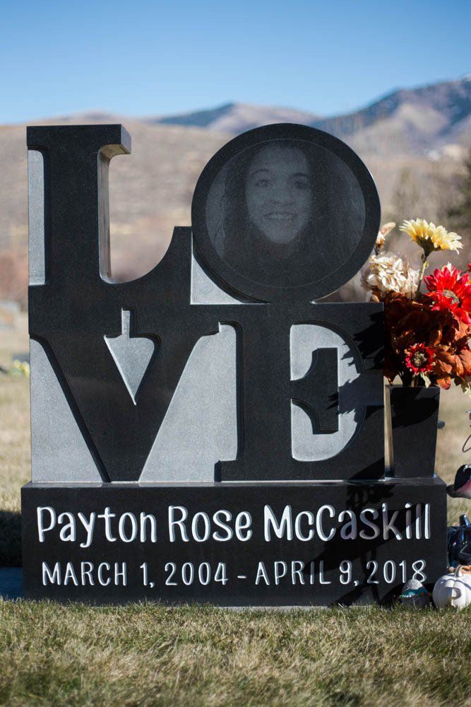 Front view of LOVE-shaped granite memorial with photo medallion and engraved letters