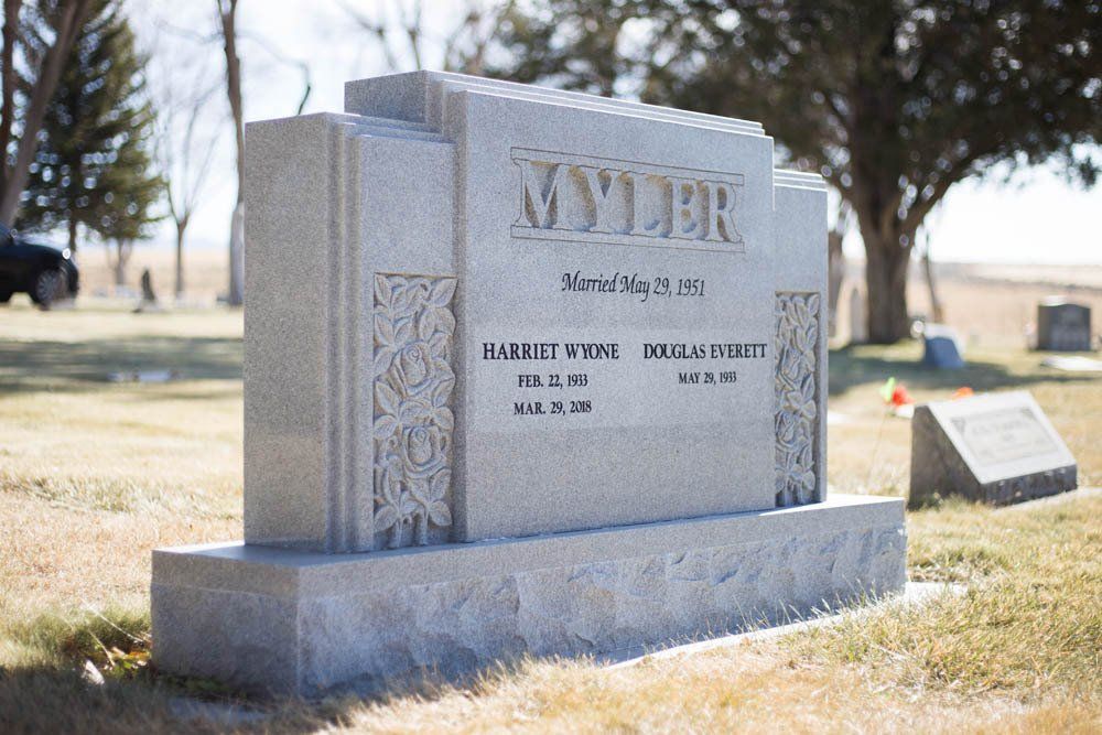 Angled view of Myler family monument featuring floral carvings and inscription “Married May 29, 1951”