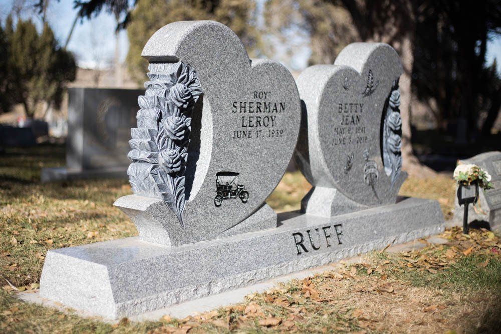 Double heart granite headstone with rose carvings for Roy Sherman Leroy and Betty Jean Ruff