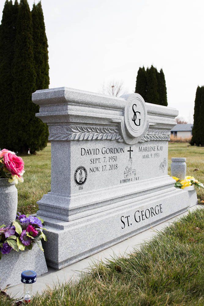 Ornate granite headstone for David Gordon and Marlene Kay St. George with SG monogram and scripture references