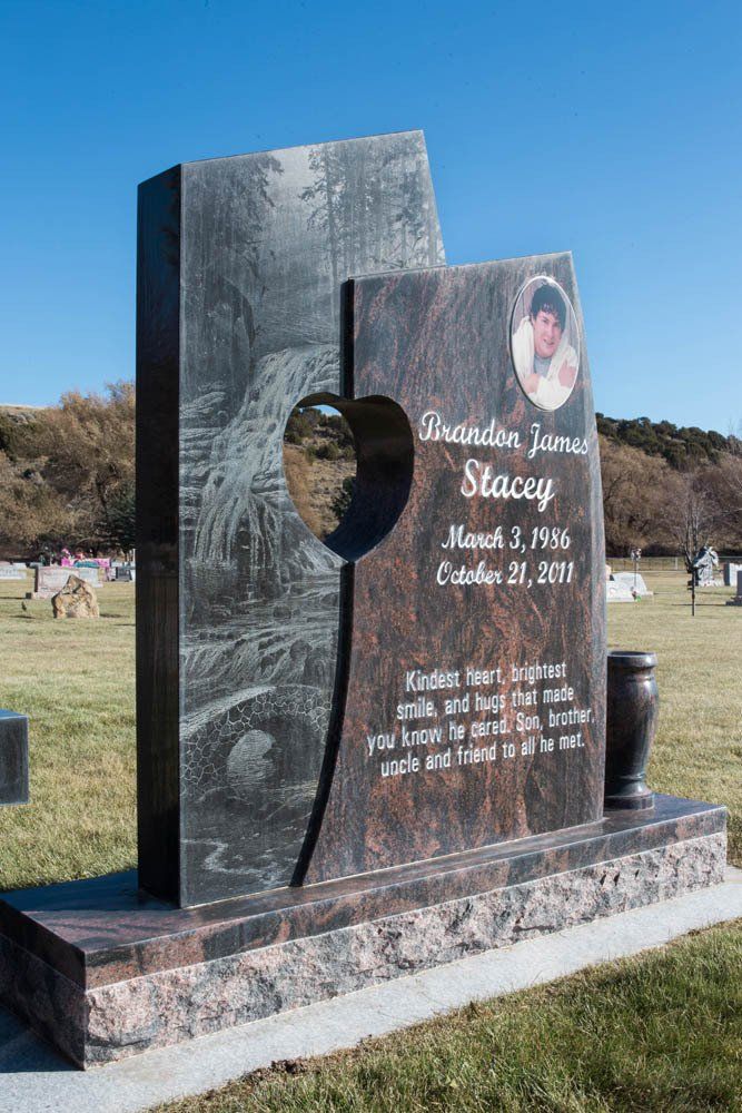 Unique headstone for Brandon James Stacey with heart-shaped cutout and engraved tribute