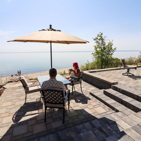 A fire pit is sitting in front of a house