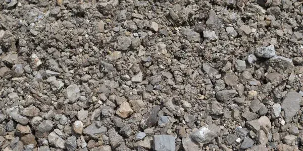 A pile of gravel is sitting on the ground.