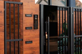 Modern residential gates made with steel and painted in black in Wollongong NSW.