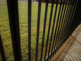 Wrought iron fence painted in black installed in a public park in Wollongong NSW.