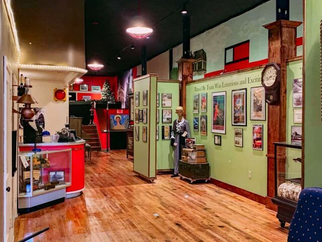 There is a clock on the wall in the middle of the room.