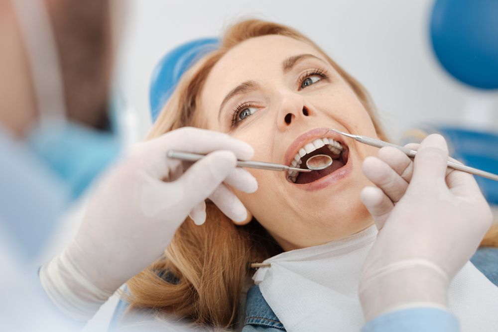 women in dental chair having a dental checkup