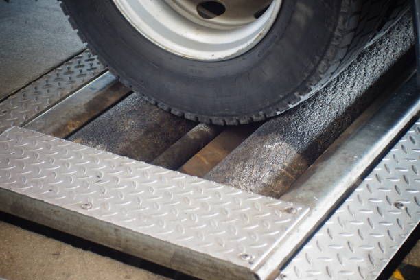 A close up of a tire on a metal platform.