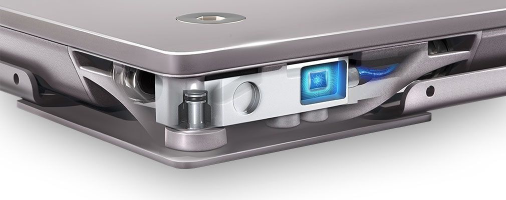 A close up of a laptop with a blue light on it.