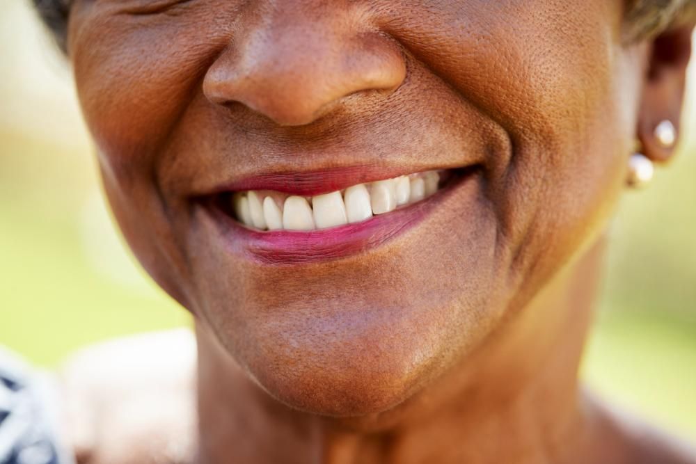 natural teeth and dental implants