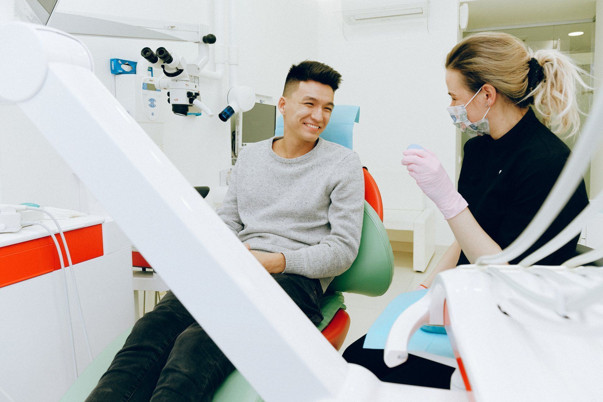 dental hygenist speaking with a patient