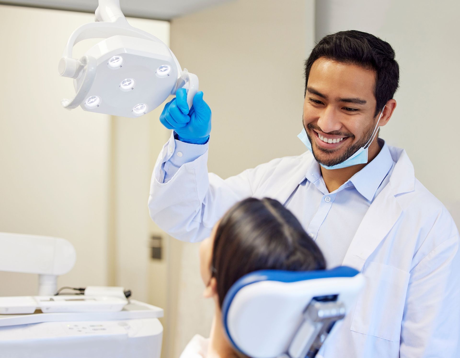 dental hygenist using a light