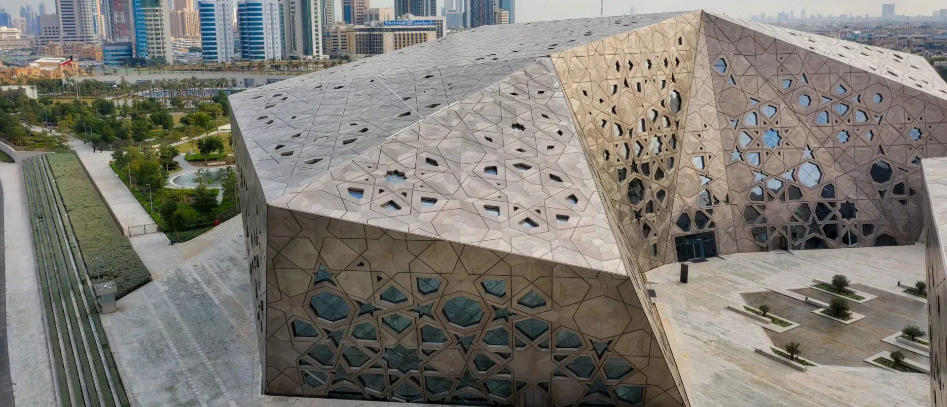 An aerial view of the Qatar National Library with a distinctive geometric design.