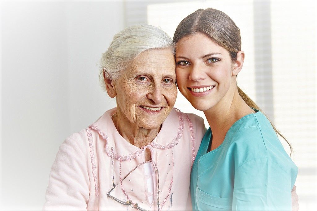 female nurse with an elderly female patient