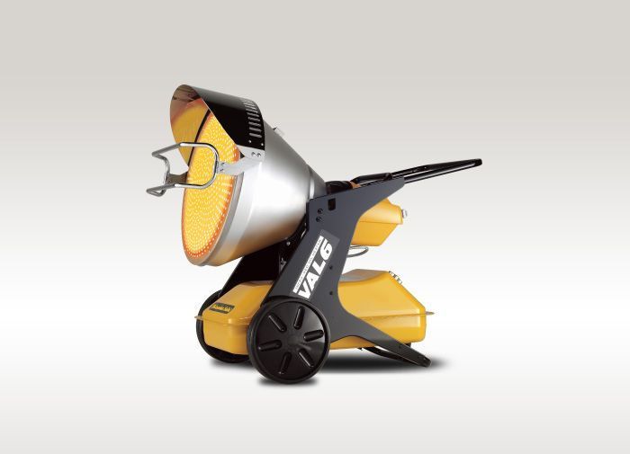 Three people in hard hats reviewing blueprints in a white room.